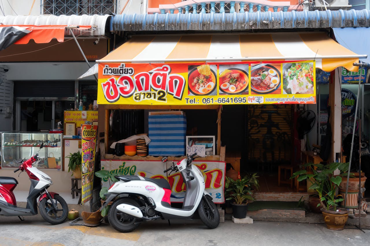 A small restaurant with a colorful banner in Pattaya,Thailand